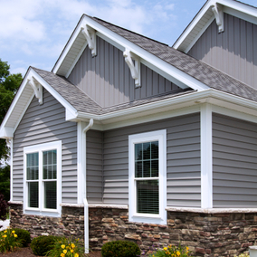 Home featuring HearTech siding in the color granite.